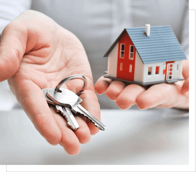 A person holding keys and a house in their hands.