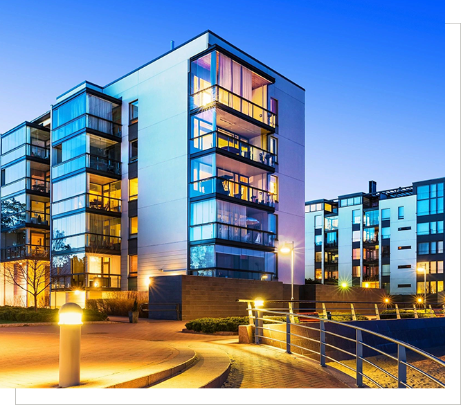 A building with many windows and lights on it